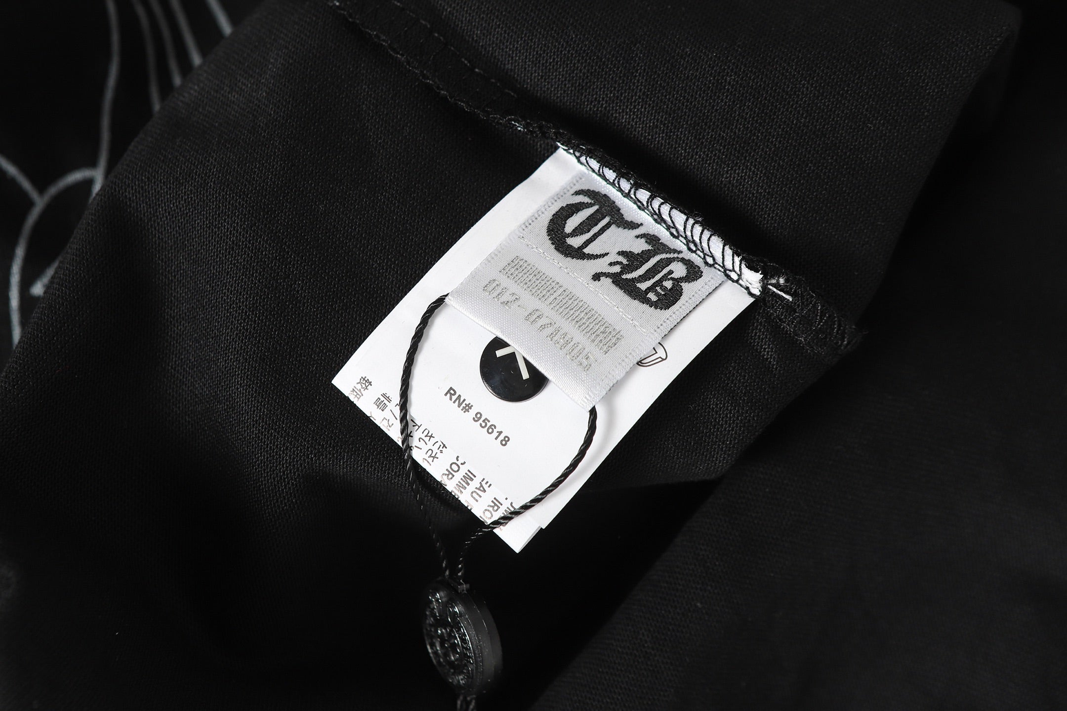Cross Monogram White Horseshoe Collar Black T-Shirt™