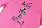 Checker Cross Vanity Affair Pink T-Shirt™