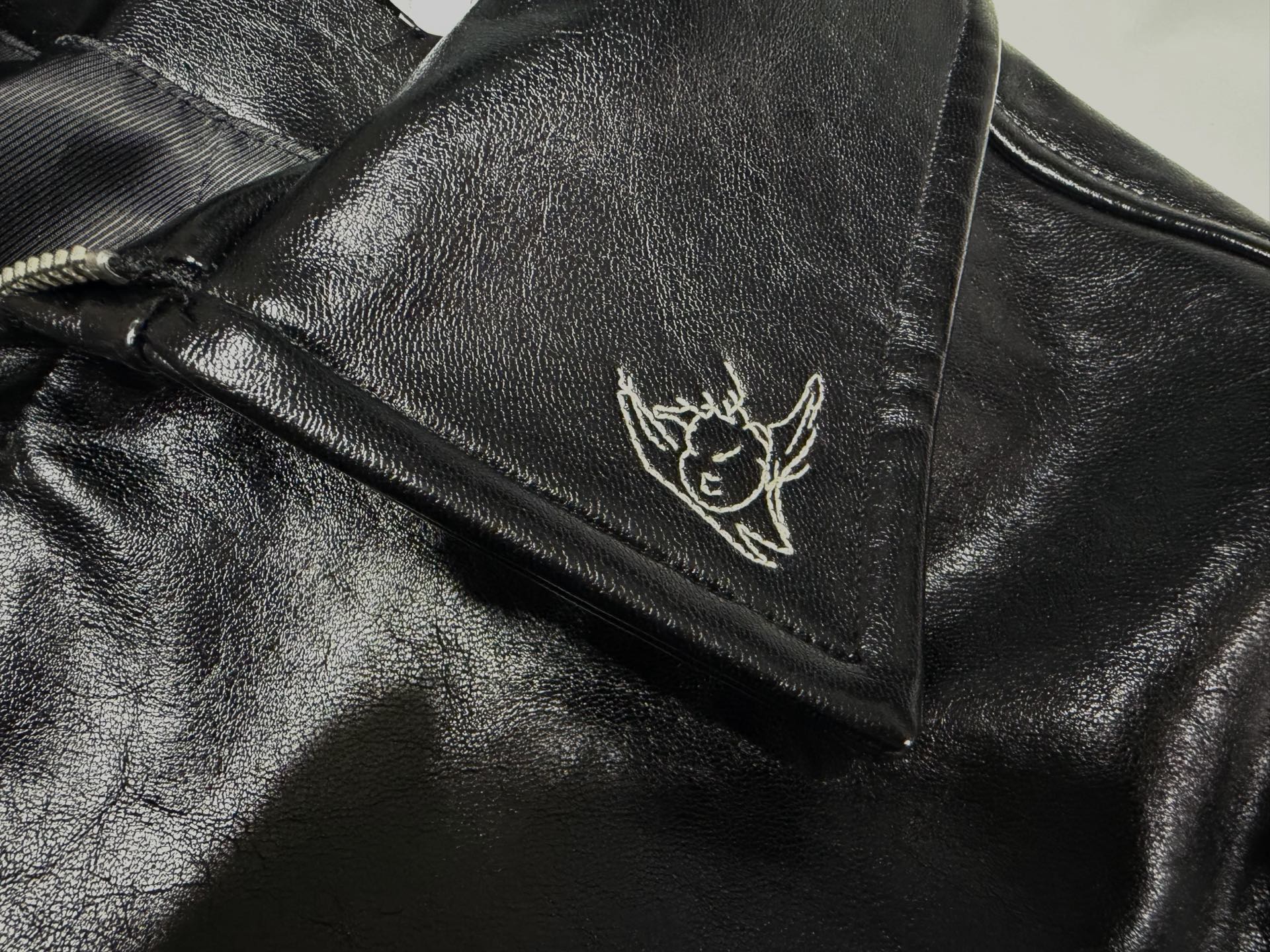 ER* Embroidered Graphic Black Leather Jacket™