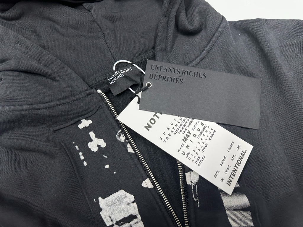 ER* Artist Defends Washed Black Zip Hoodie™