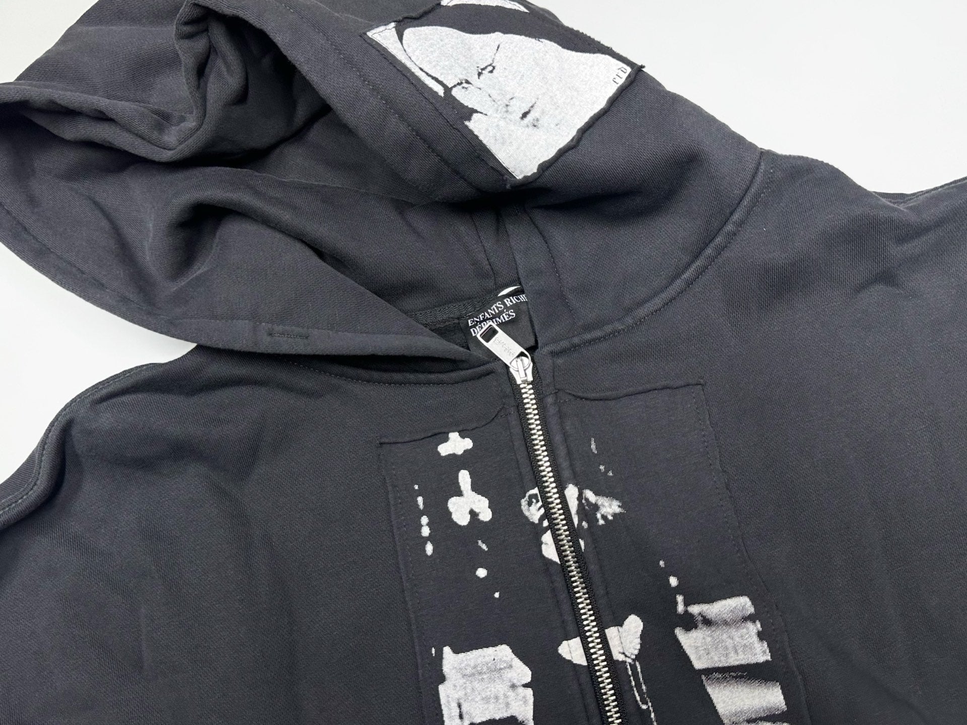 ER* Artist Defends Washed Black Zip Hoodie™
