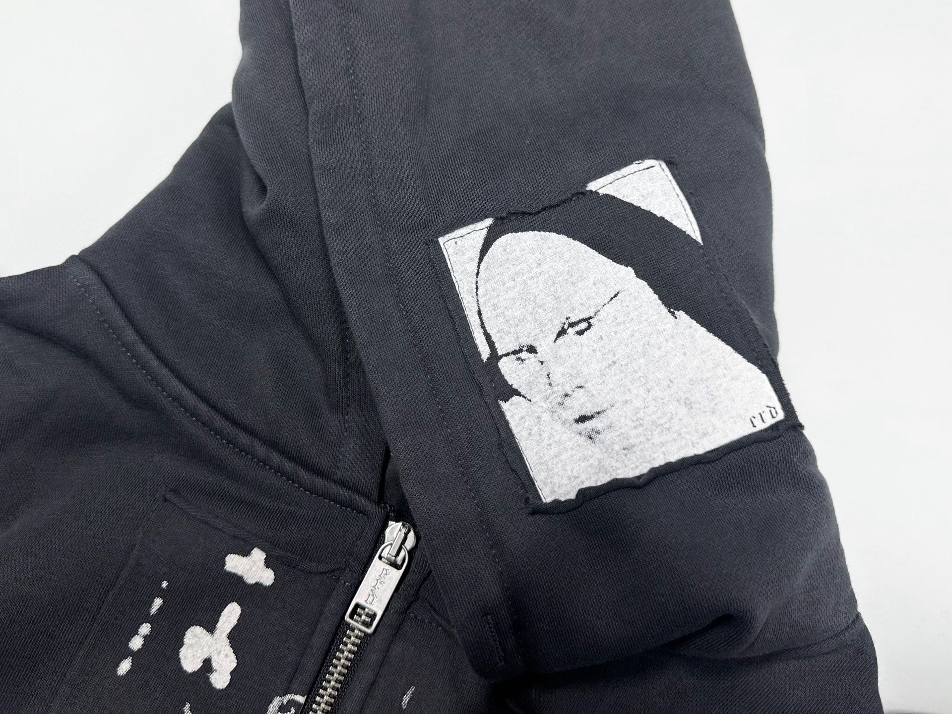 ER* Artist Defends Washed Black Zip Hoodie™