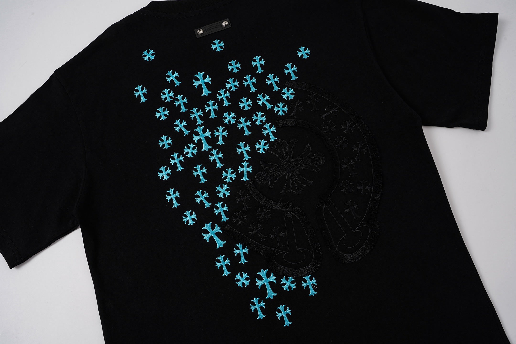 Turquoise Cross Scatter Black T-Shirt™