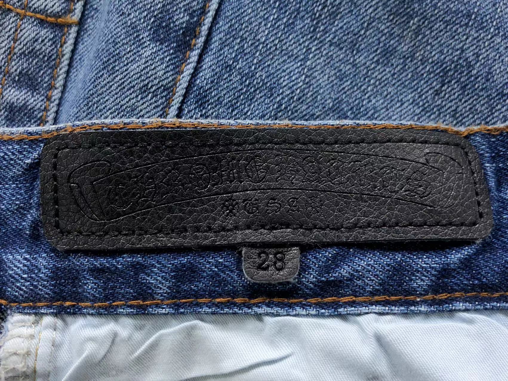 Black Cross Patch Distressed Denim Jeans™