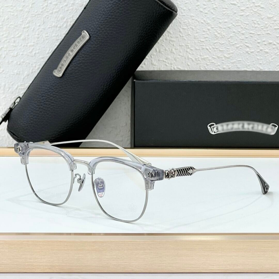 Clear eyeglasses with a black case and box on a light background