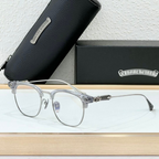 Clear eyeglasses with a black case and box on a light background