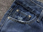White Cross Patch Distressed Denim Jeans™