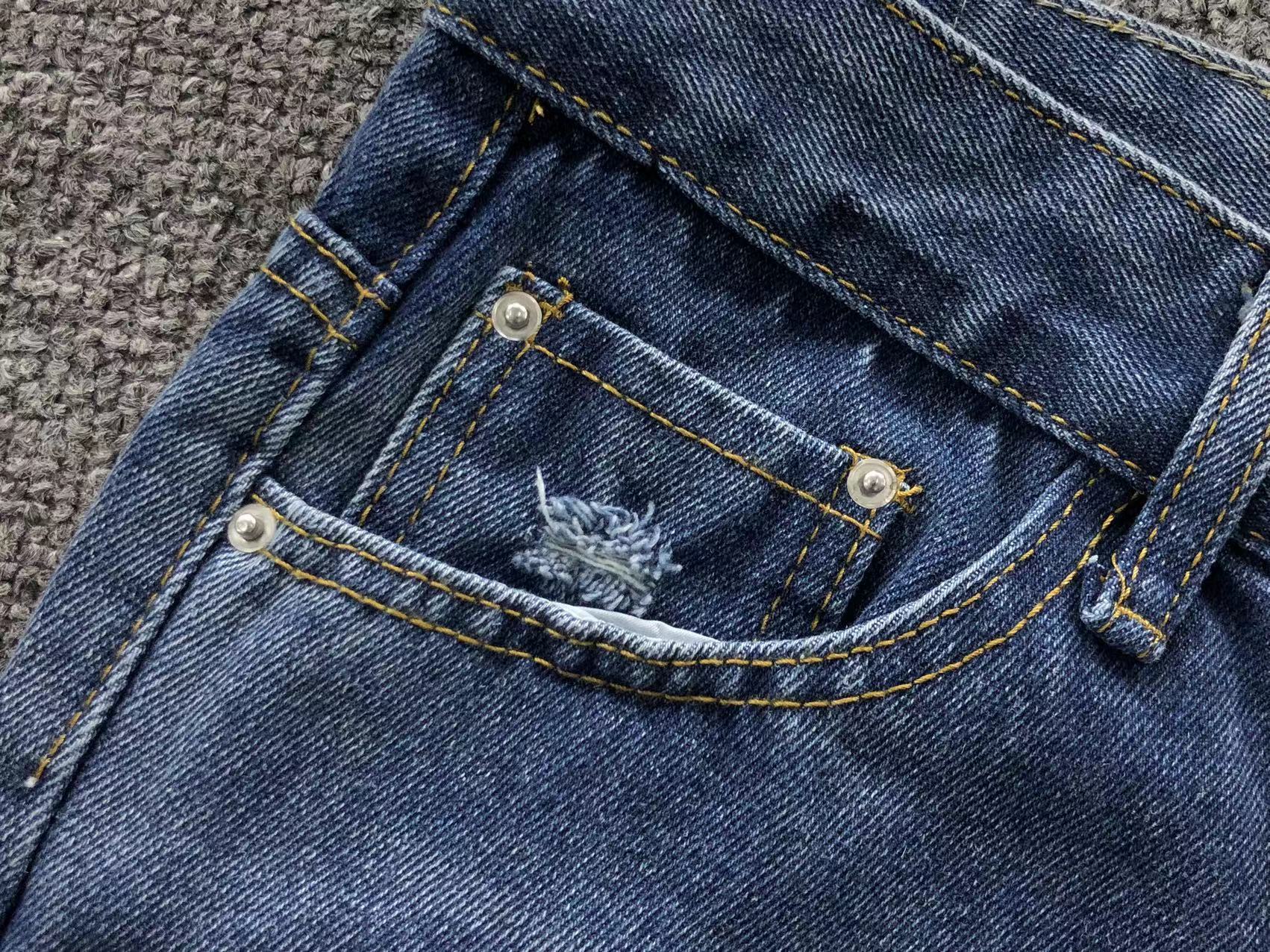 White Cross Patch Distressed Denim Jeans™