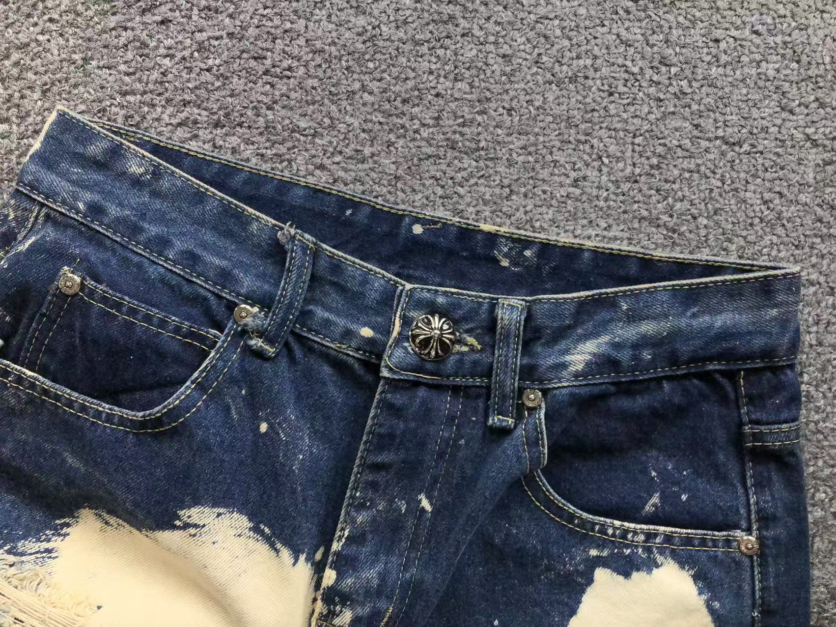 White Brown & Orange Cross Patch White Paint Marks Dark Blue Denim Jeans™