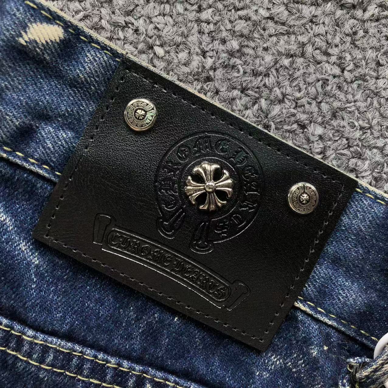 White Brown & Orange Cross Patch White Paint Marks Dark Blue Denim Jeans™