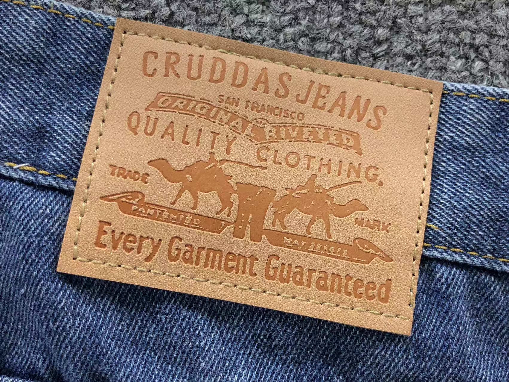 White Cross Patch Distressed Denim Jeans™