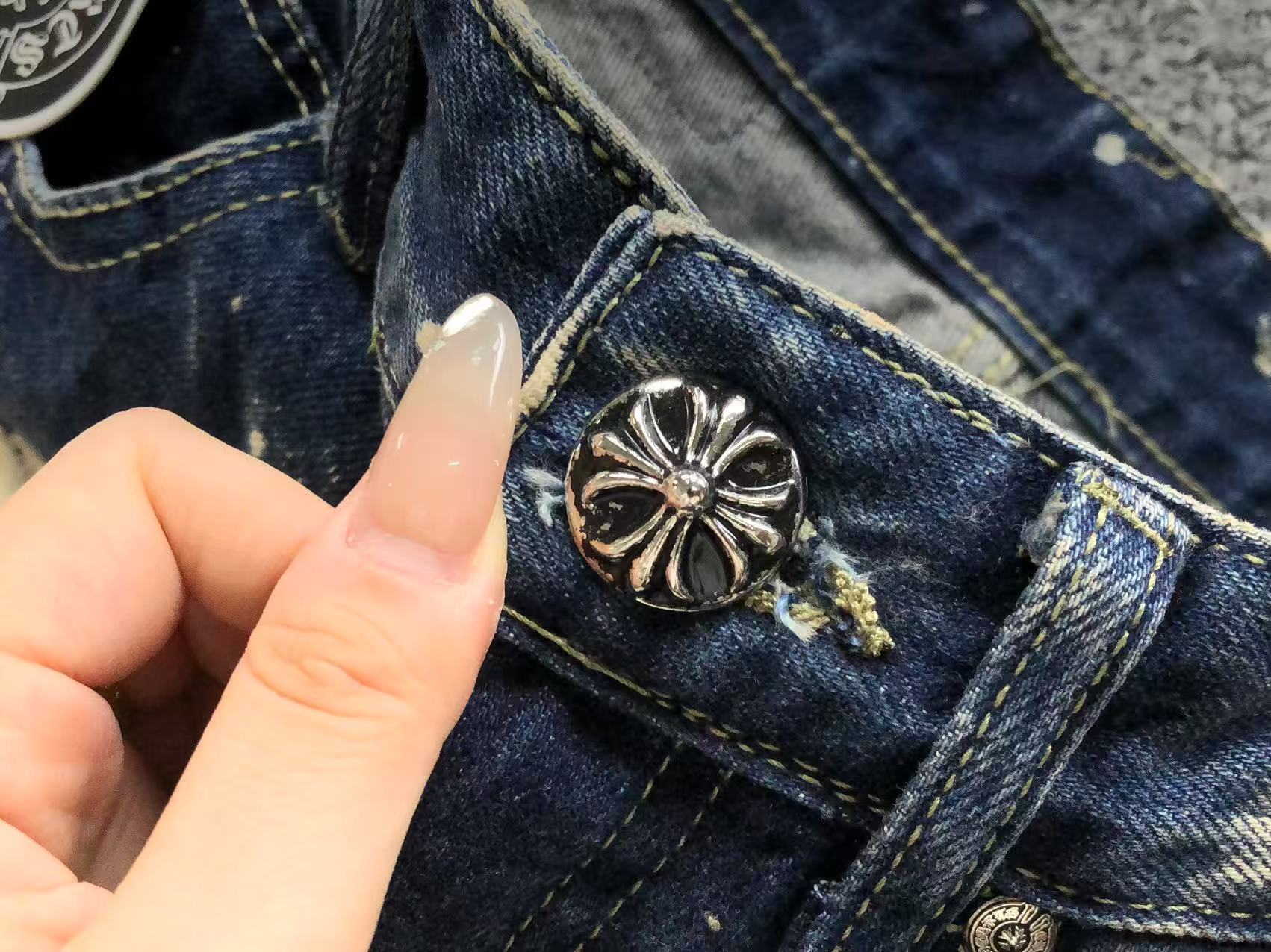 White Brown & Orange Cross Patch White Paint Marks Dark Blue Denim Jeans™