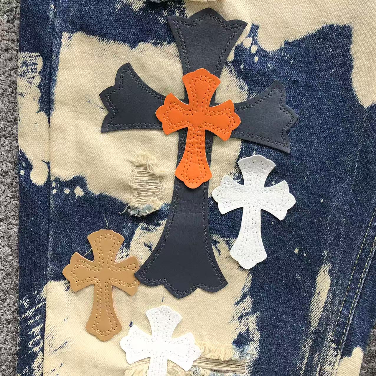 White Brown & Orange Cross Patch White Paint Marks Dark Blue Denim Jeans™