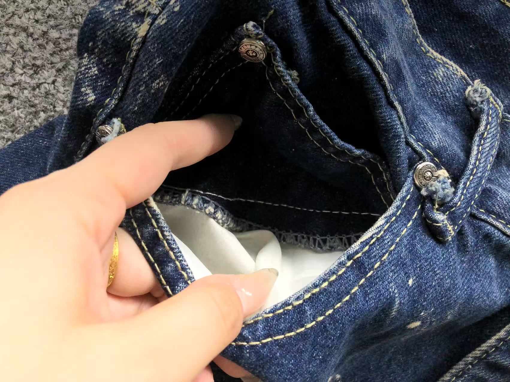 White Brown & Orange Cross Patch White Paint Marks Dark Blue Denim Jeans™