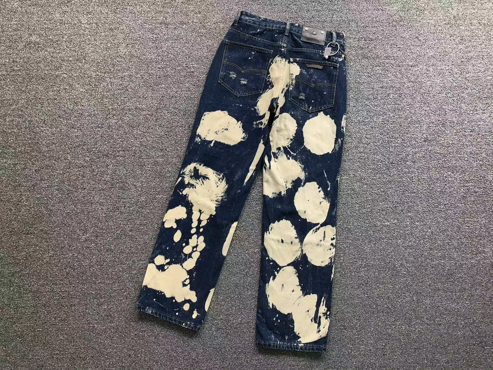 White Brown & Orange Cross Patch White Paint Marks Dark Blue Denim Jeans™