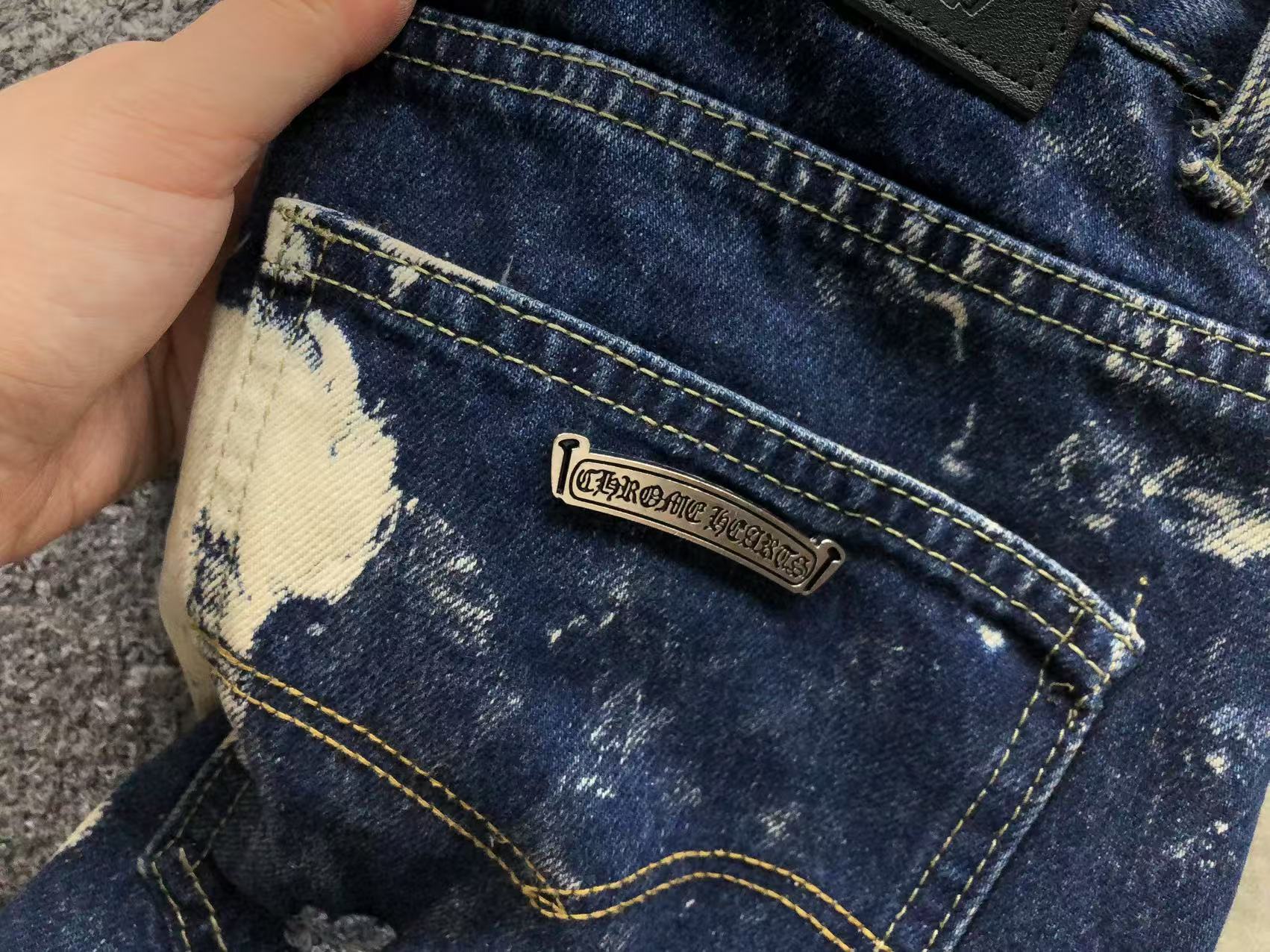 White Brown & Orange Cross Patch White Paint Marks Dark Blue Denim Jeans™