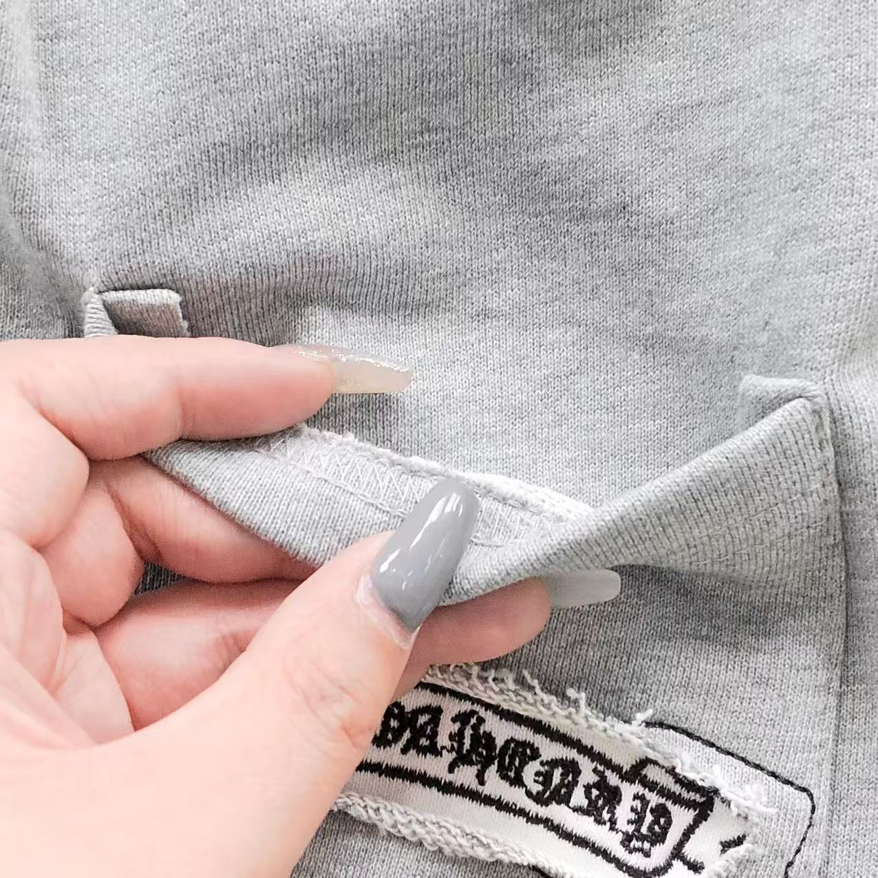 Torn Fabric Cross Grey Sweatshorts™