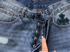 Black Cross Patch Distressed Denim Jeans™