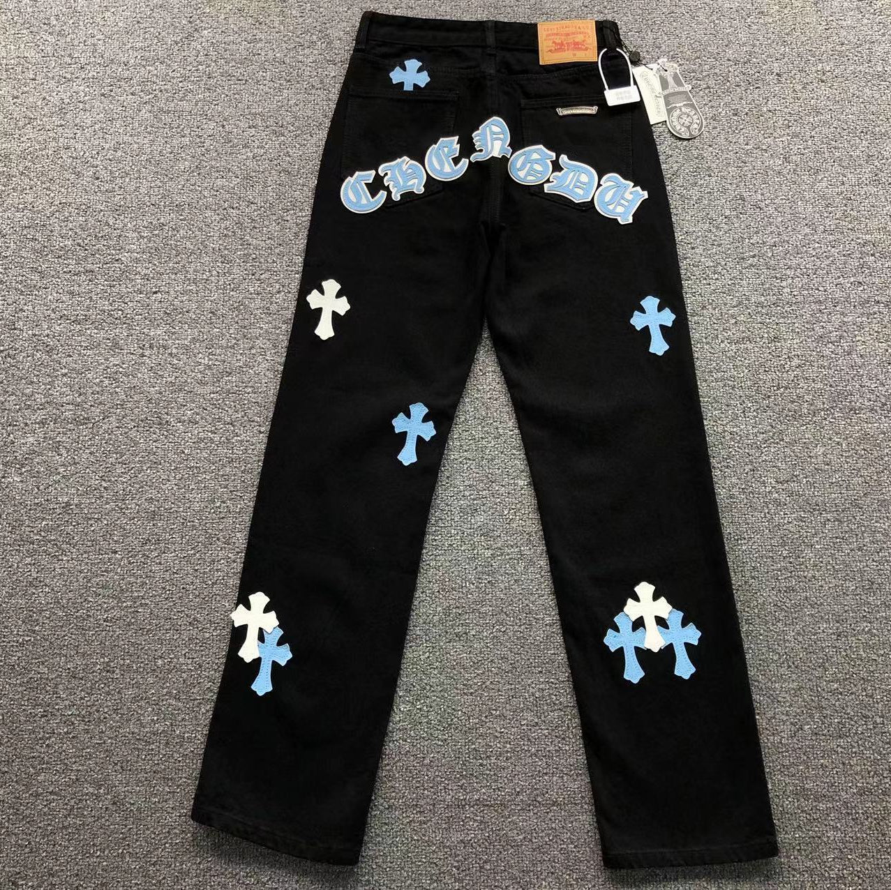 White & Light Blue Cross Patch Black Denim Jeans™