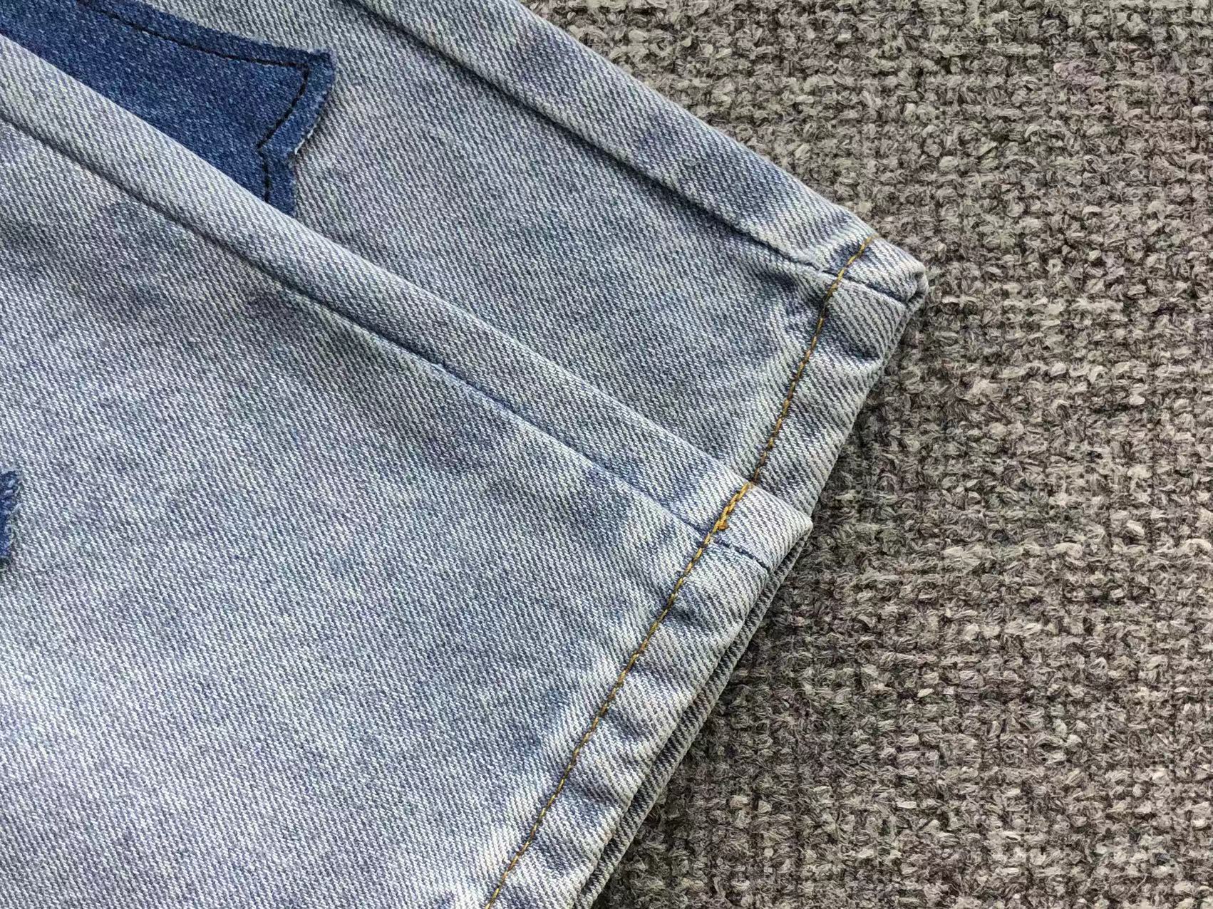 Mixed Blue & White Cross Patch Light Denim Jeans™