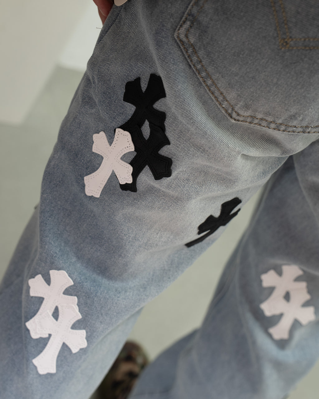 White & Black Cross Patch Light Denim Jeans™