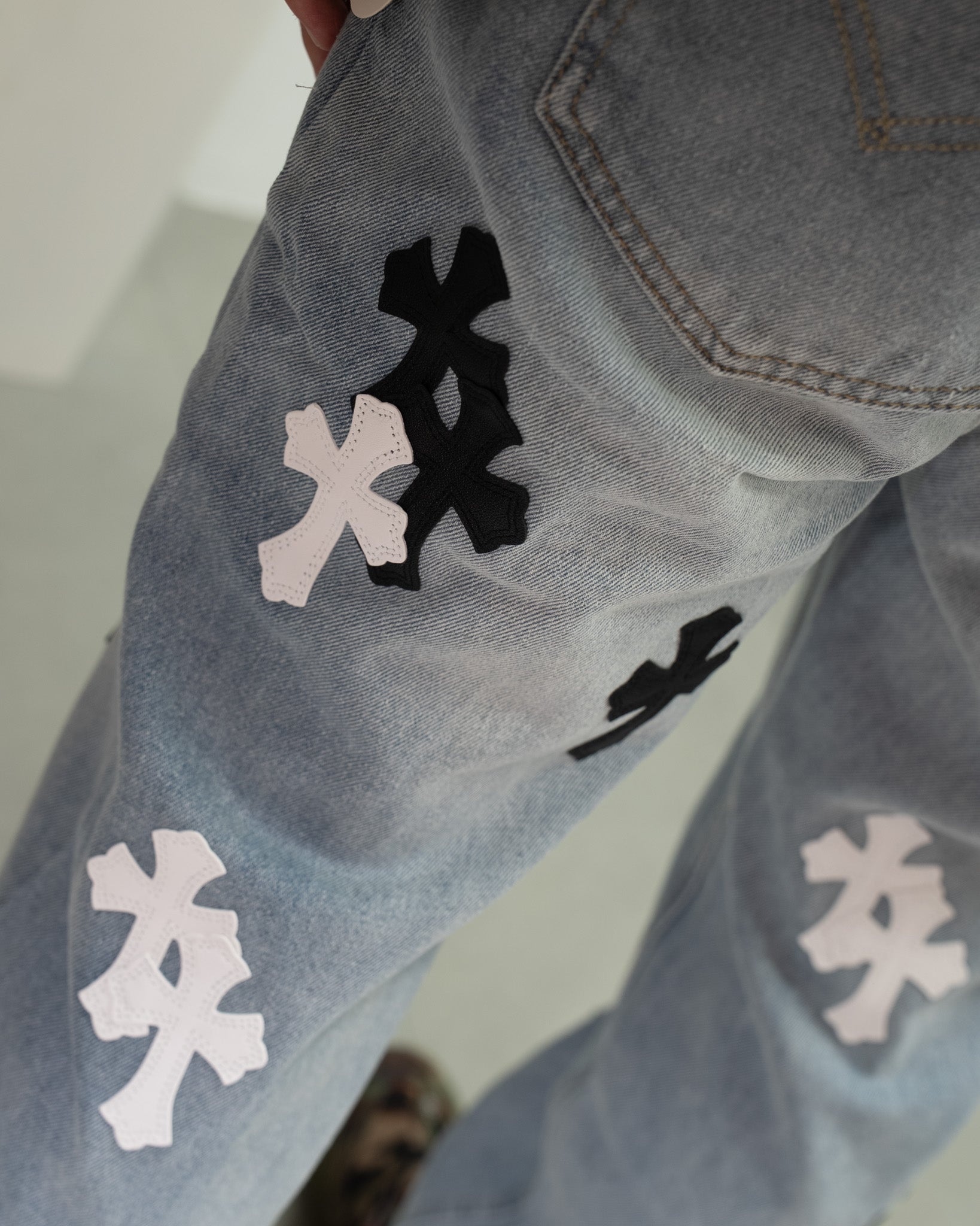 White & Black Cross Patch Light Denim Jeans™