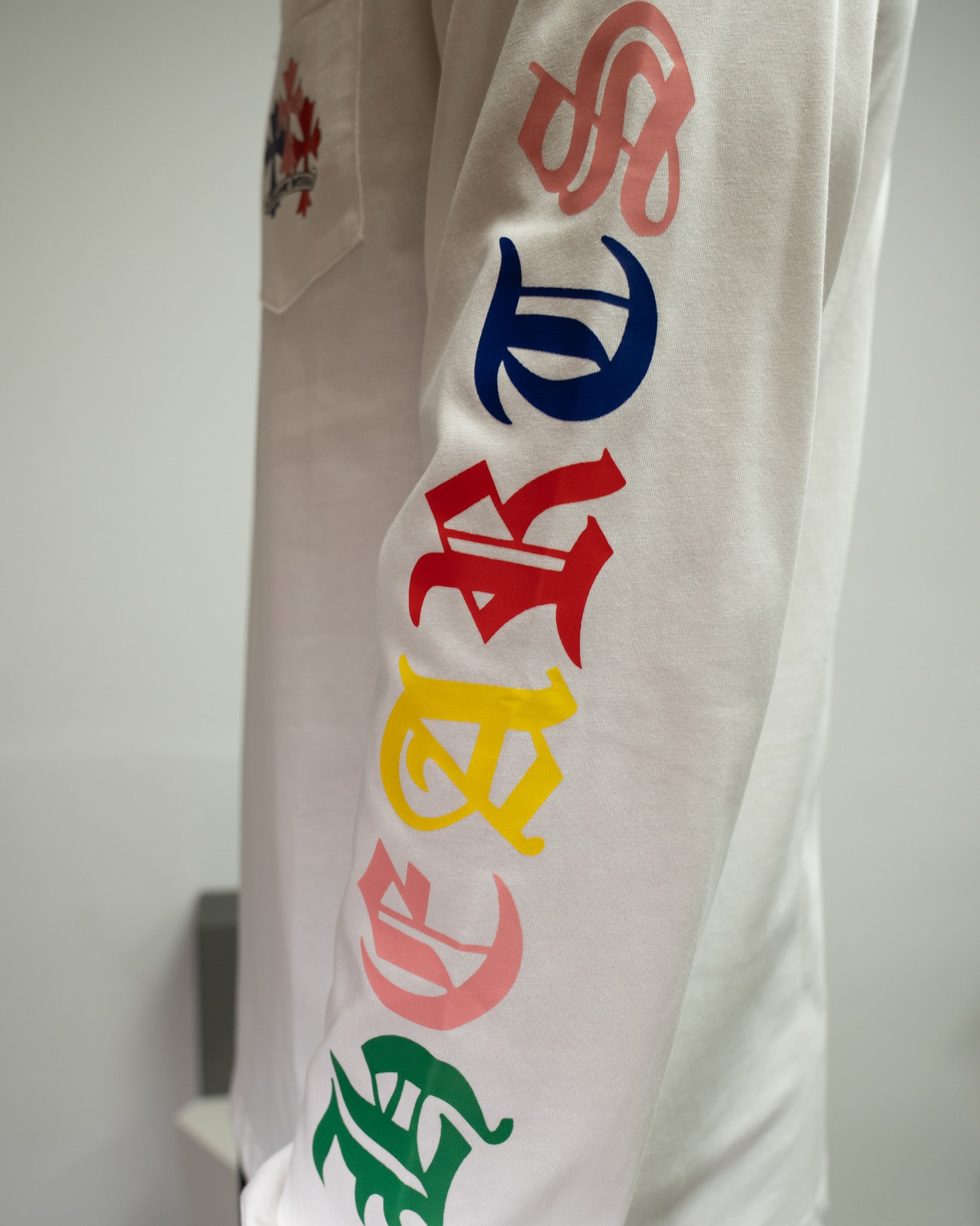 Stacked Multicolor Crosses White Long Sleeve™