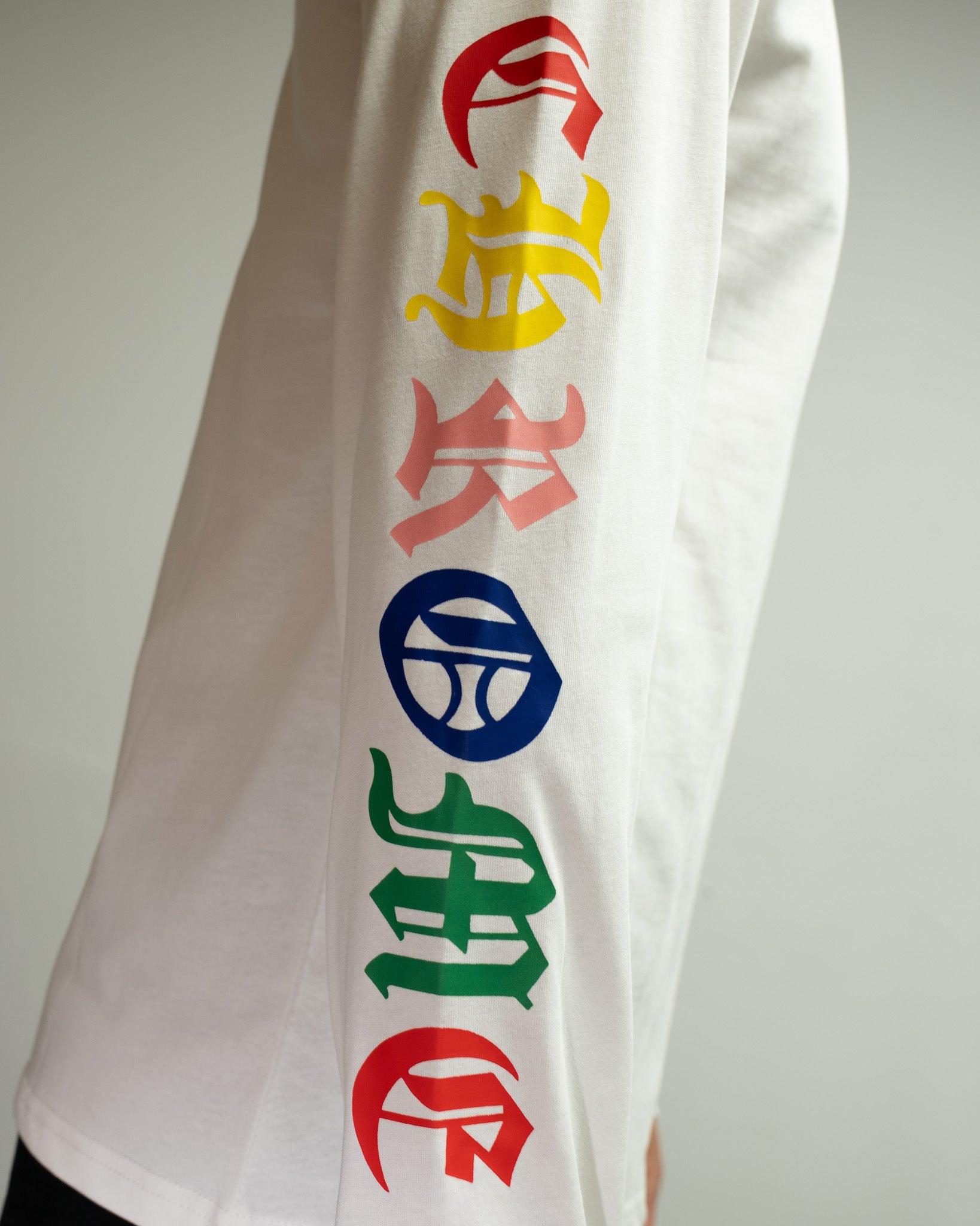 Stacked Multicolor Crosses White Long Sleeve™