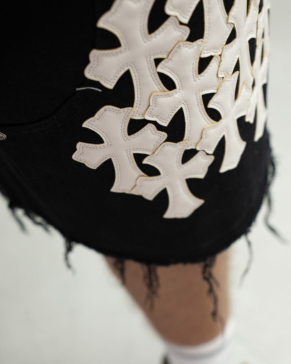 White Cross Patch Black Jean Shorts™