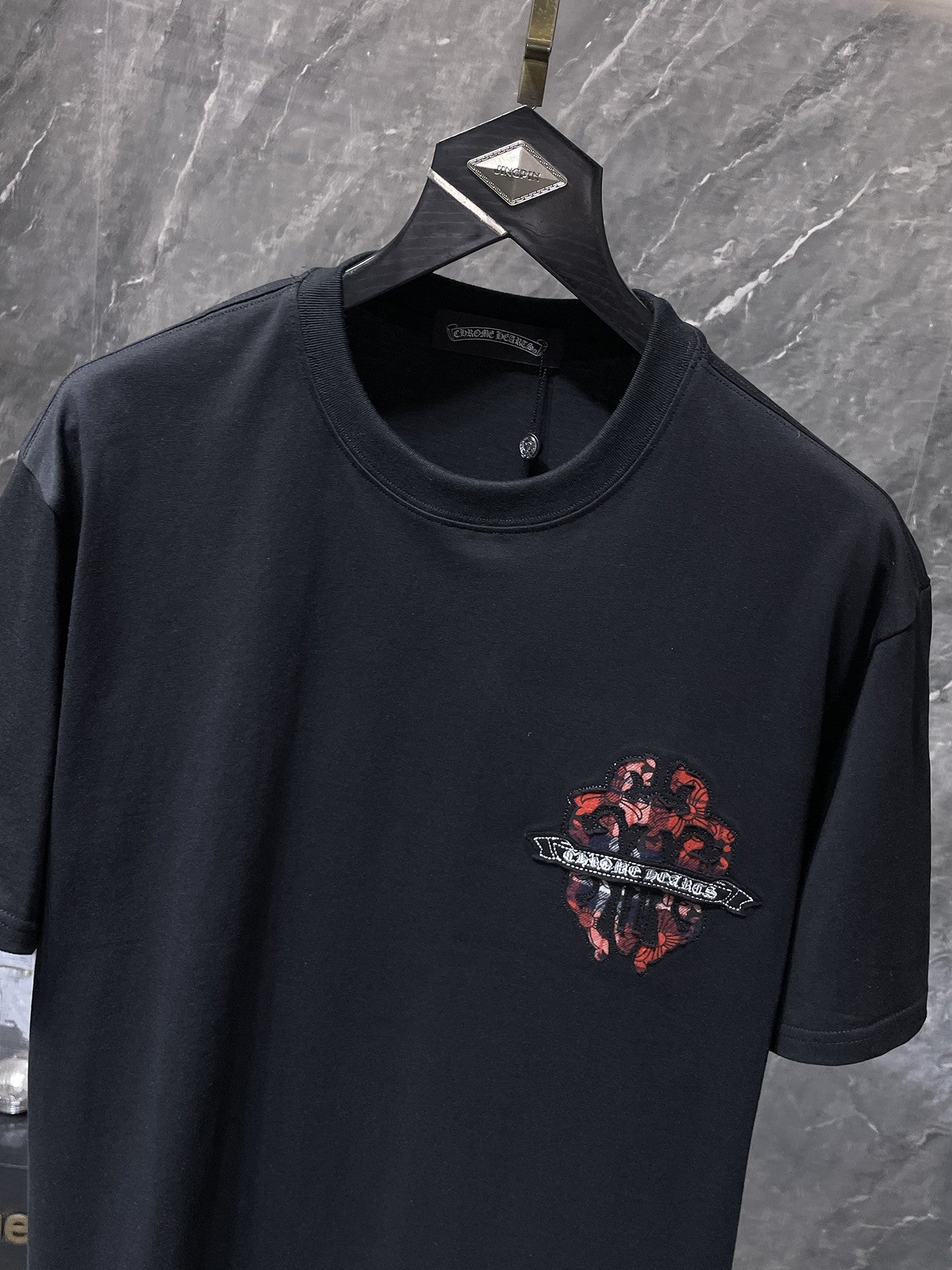 Checkered Dagger Crest Black T-Shirt™