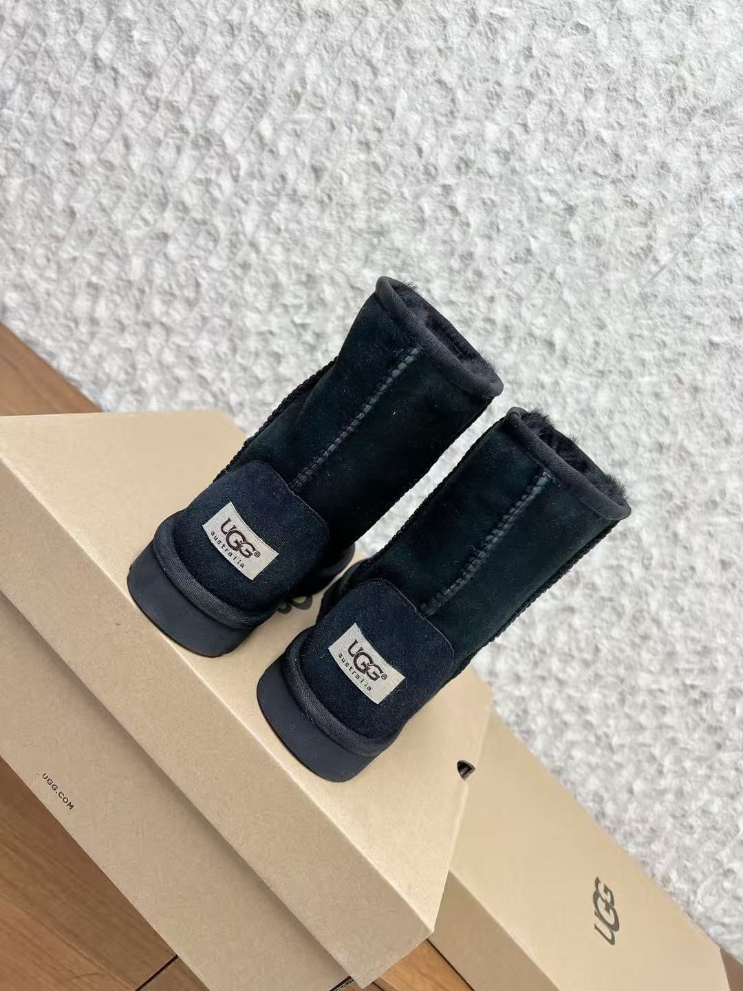 Metallic Cross Black Fur Boots™