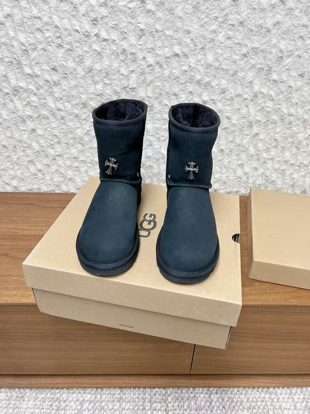 Metallic Cross Black Fur Boots™