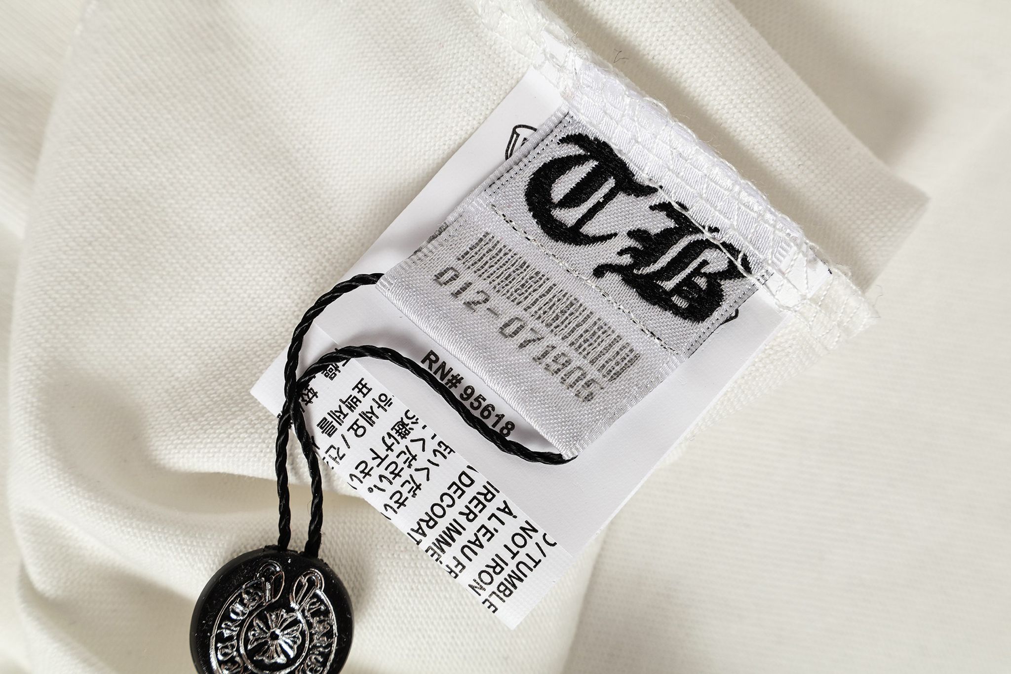 Black Leather Cross Brand Collab White T-Shirt™