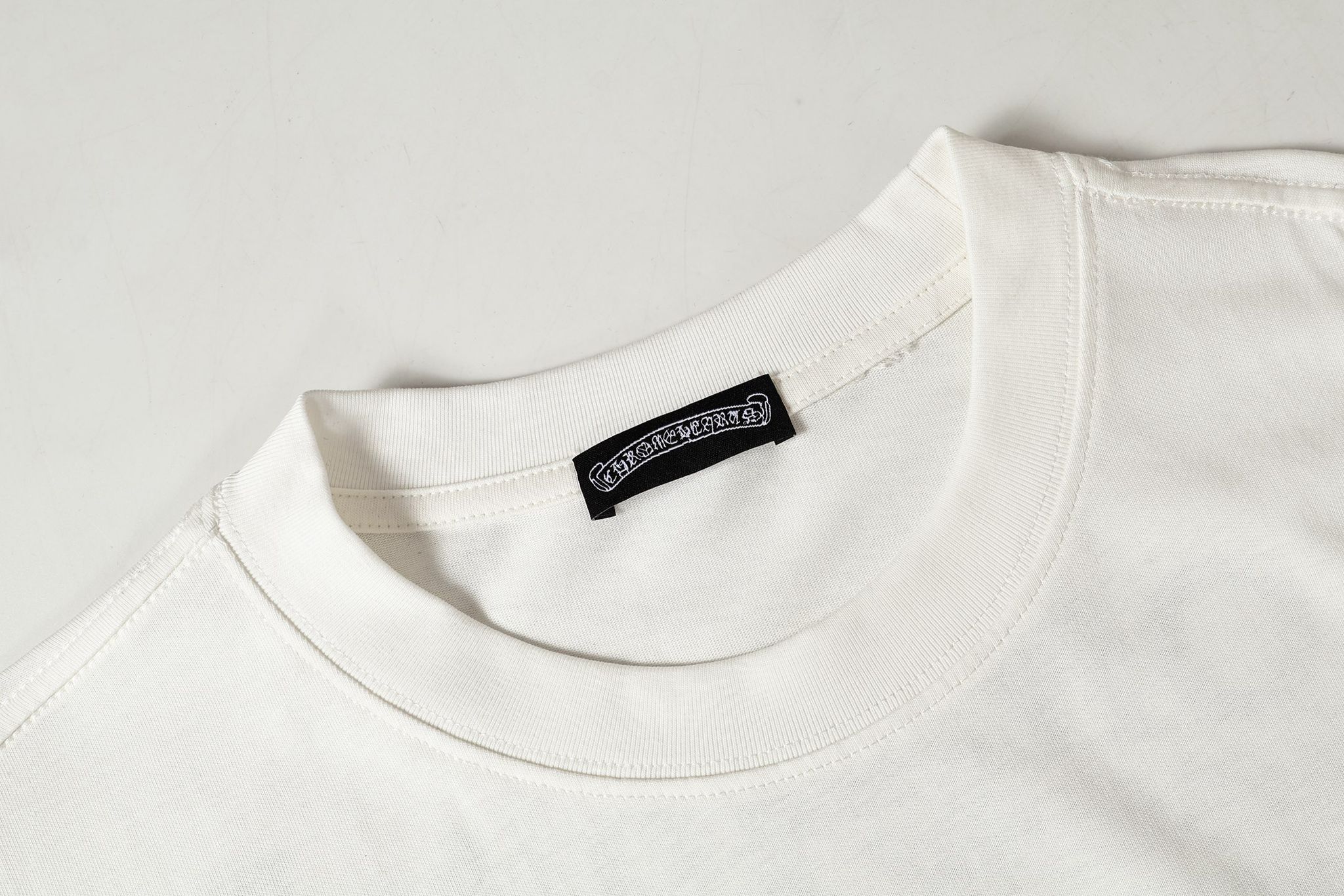Black Leather Cross Brand Collab White T-Shirt™
