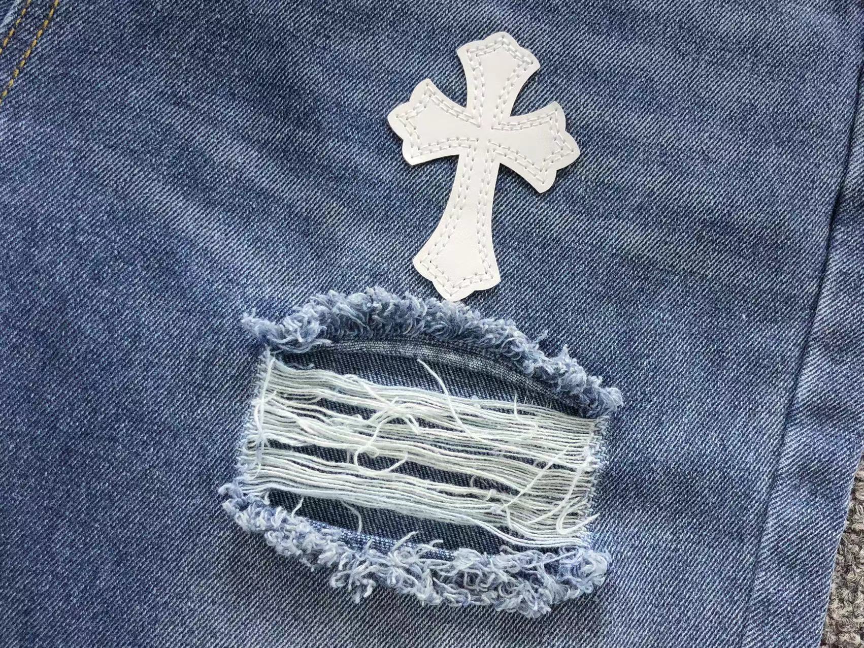 White Cross Patch Distressed Denim Jeans™