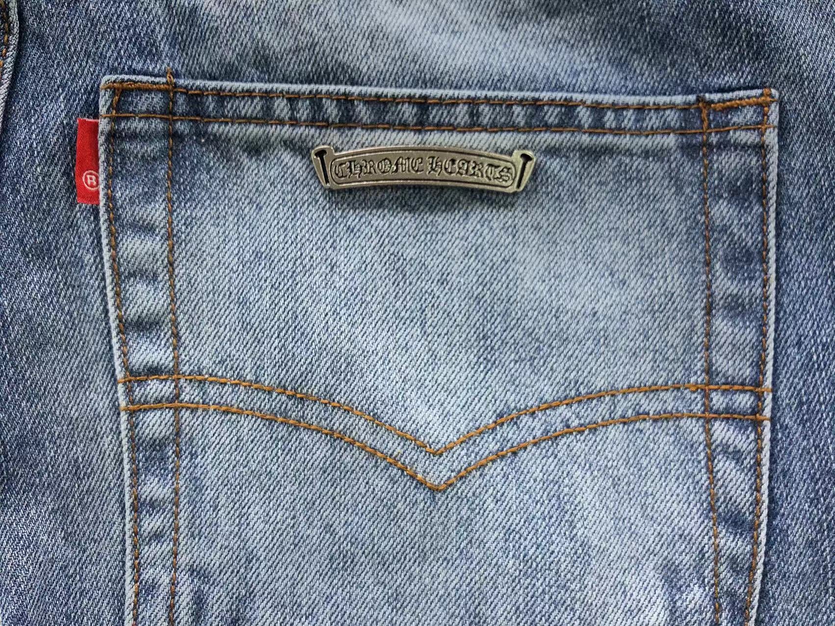 Black Cross Patch Distressed Denim Jeans™