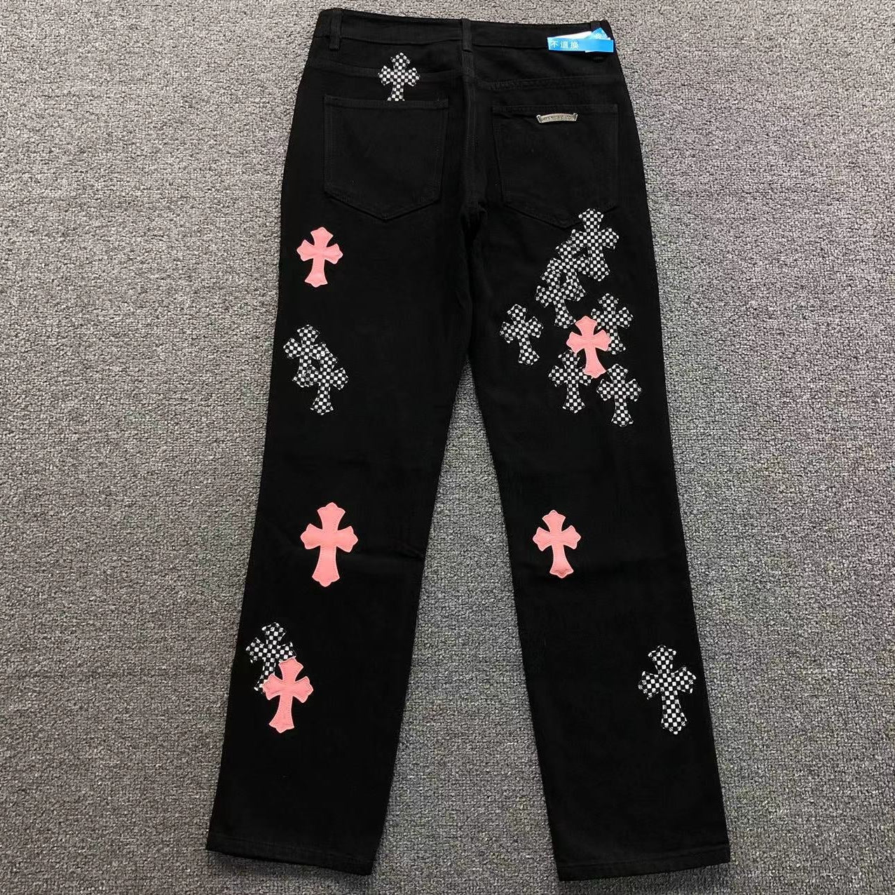 Checkered & Pink Cross Patch Black Jeans™