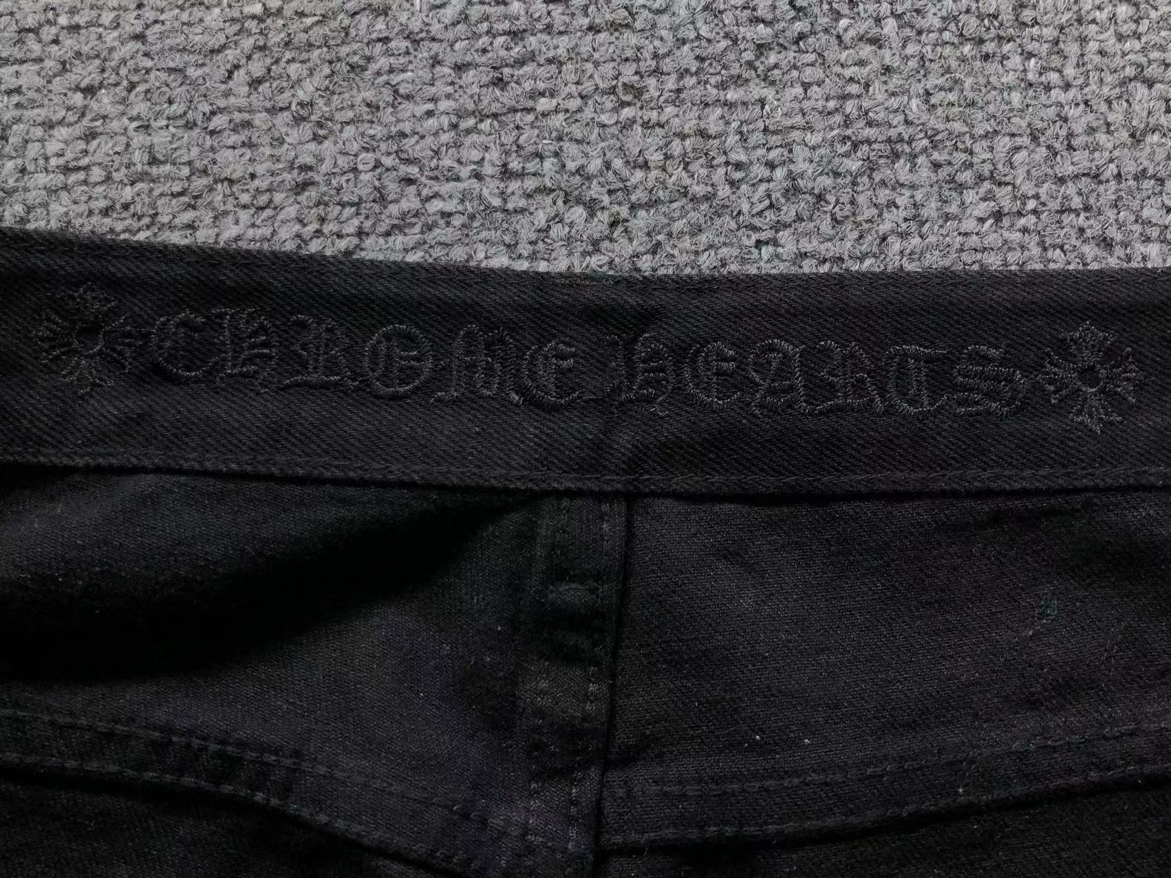 Checkered & Pink Cross Patch Black Jeans™