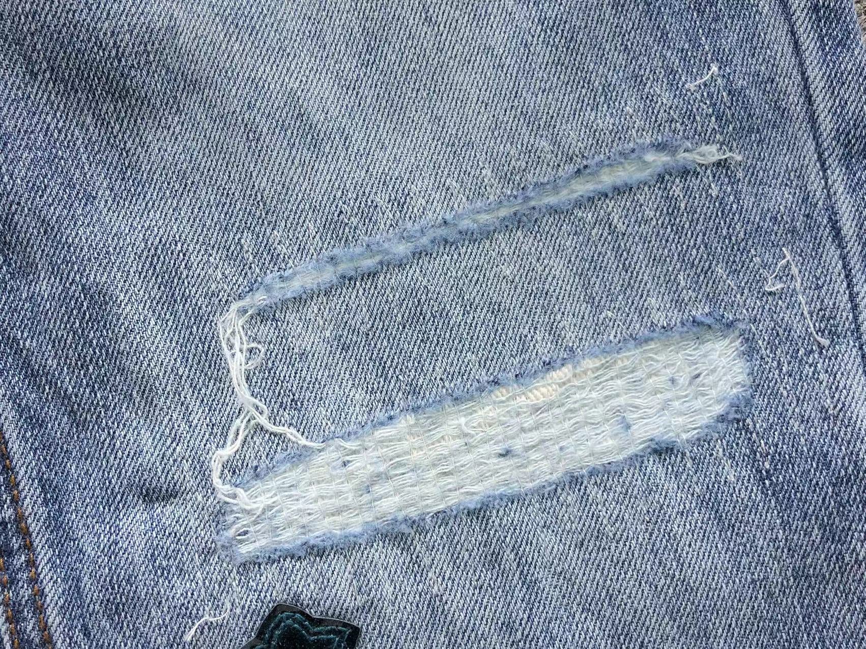Black Cross Patch Distressed Denim Jeans™