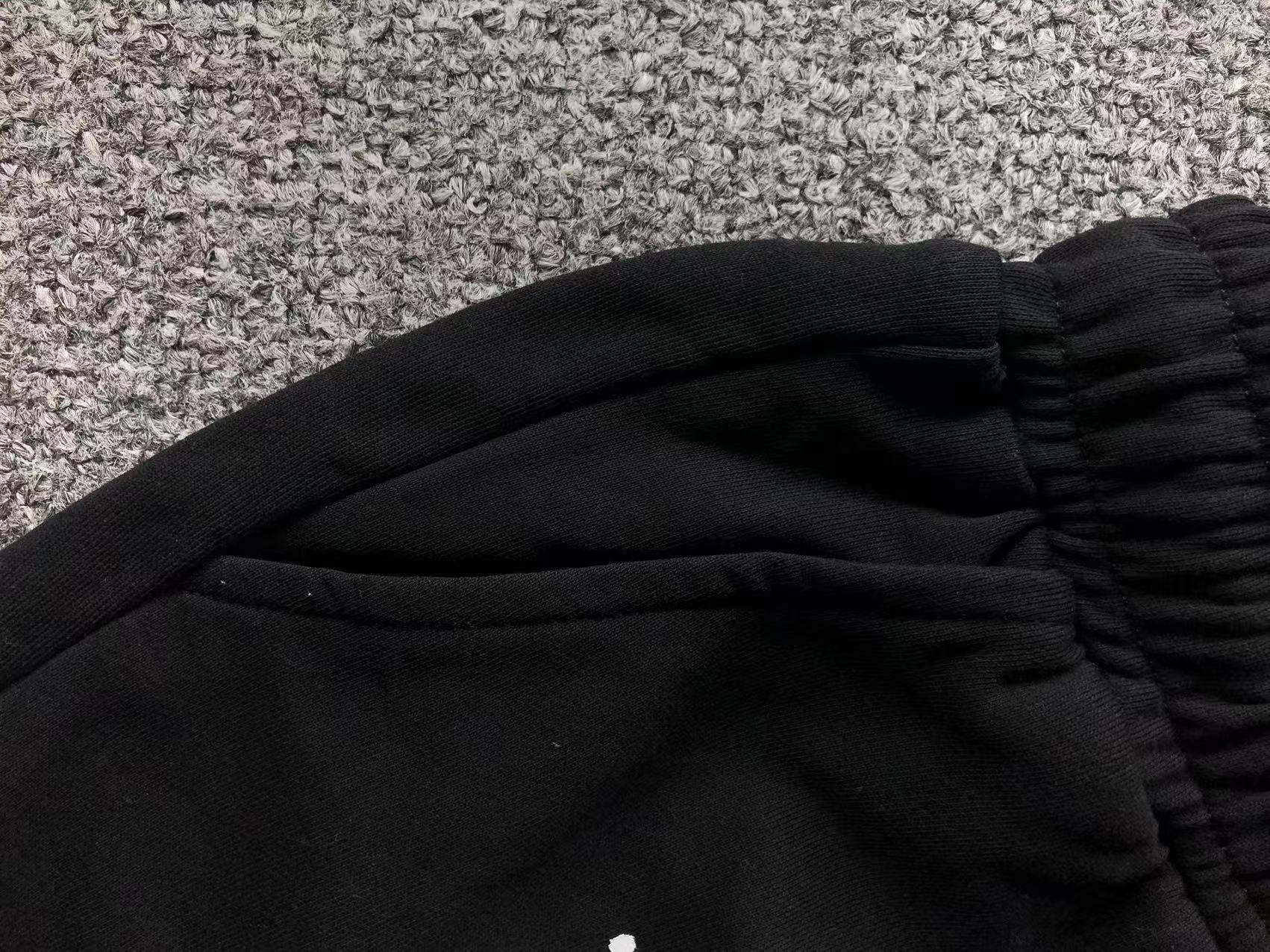 White Leather Cross Paint Drip Sweatshorts™
