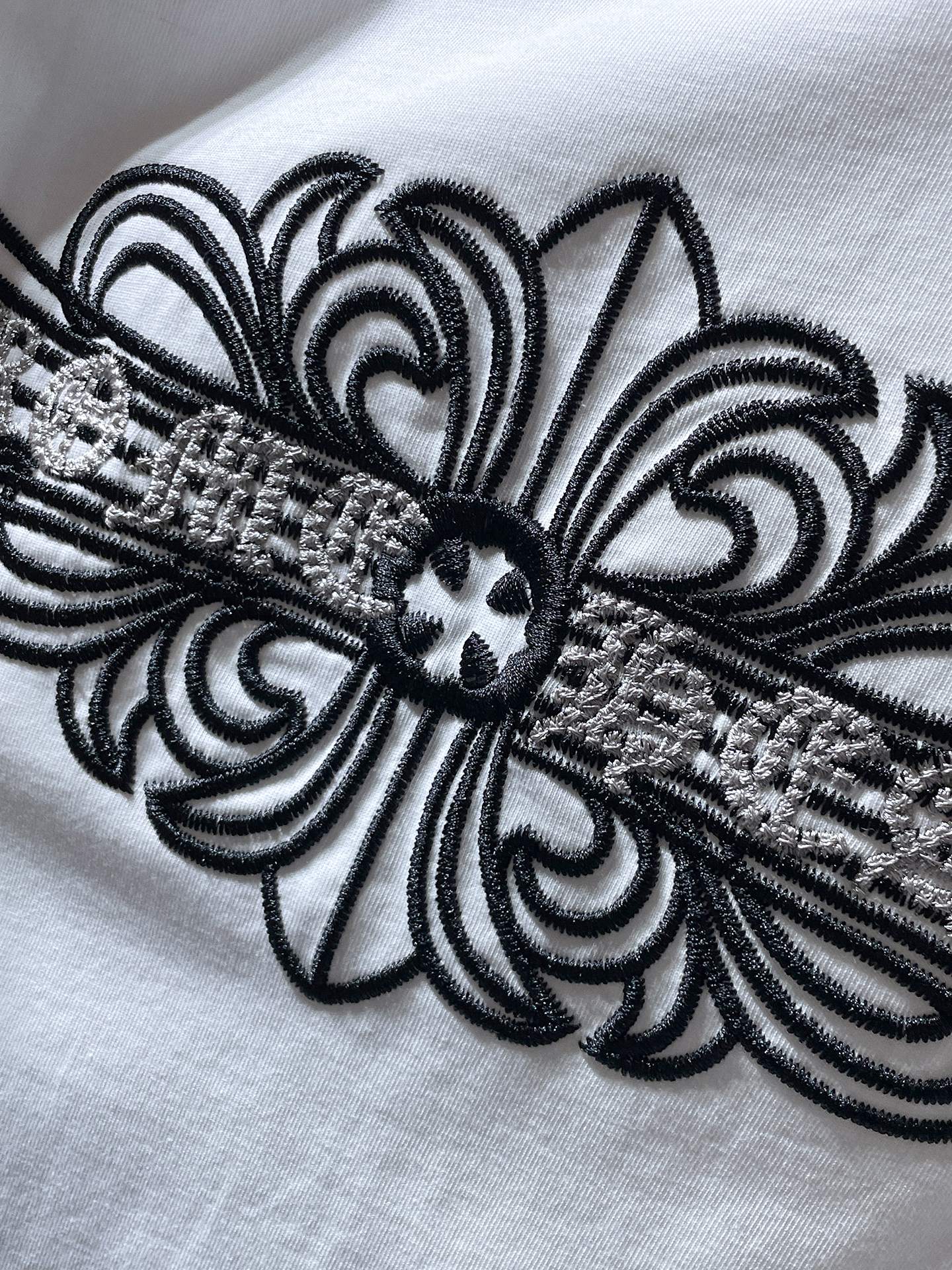 Fleur Cross Graphic White T-Shirt™