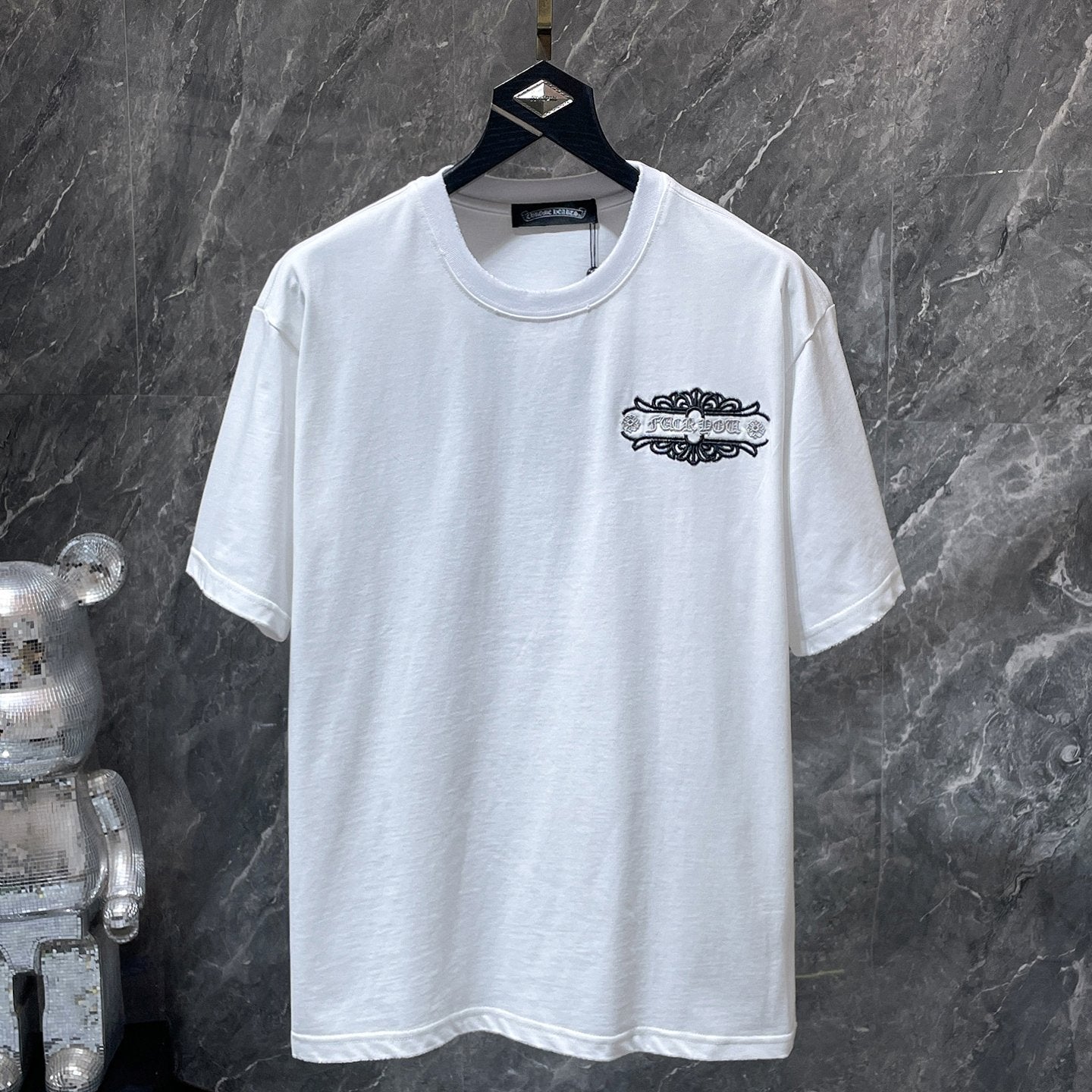 Fleur Cross Graphic White T-Shirt™